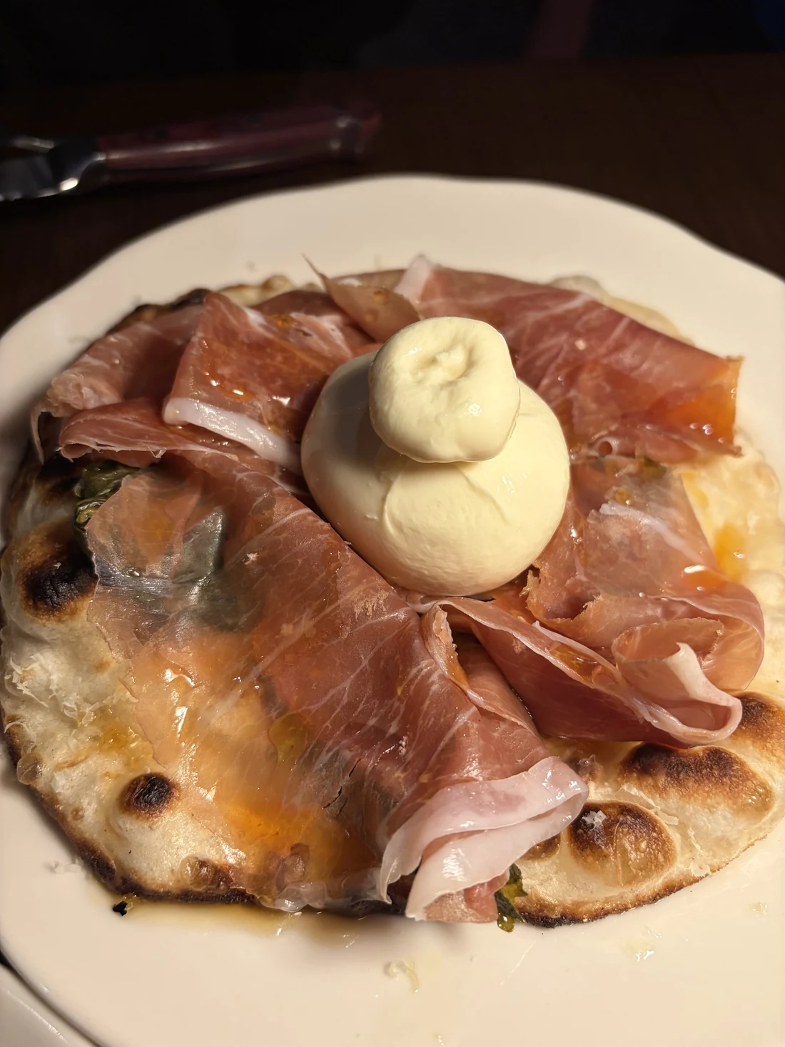 Grilled flatbread with prosciutto, burrata and hot honey at Common Cuts, Melbourne