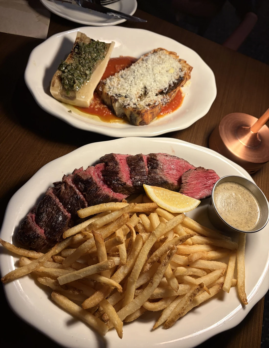 Steak with chips and peppercorn sauce alongside the bone marrow lasagne at Common Cuts, Melbourne